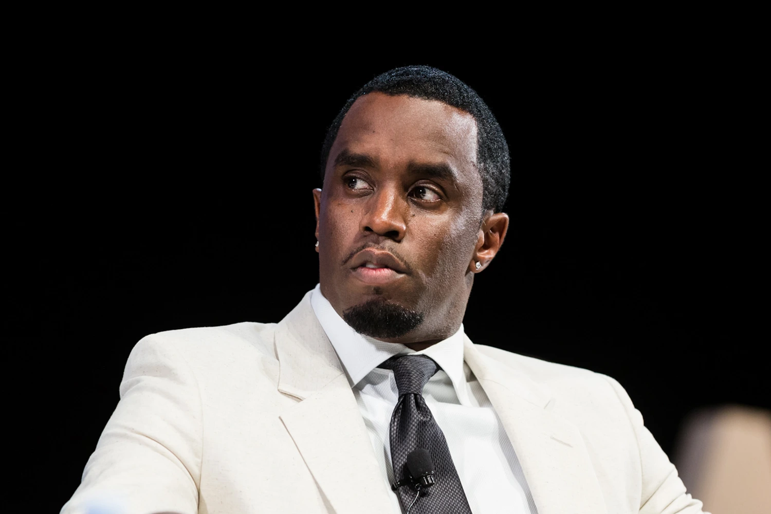 p diddy in a white suit