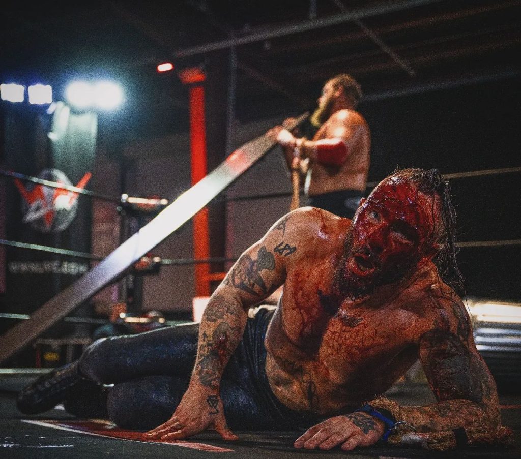 August Artois covered in blood